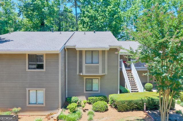 2937 Torreya Way SE, Marietta, GA 30067 - view of front of home with stairs, a deck, and roof with shingles