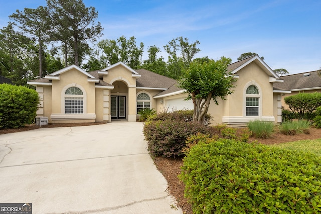 268 Osprey Cir, Saint Marys, GA 31558 - ranch-style home with driveway, a garage, and stucco siding