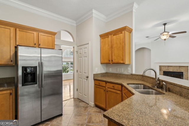 268 Osprey Cir, Saint Marys, GA 31558 - kitchen with a sink, brown cabinets, stainless steel fridge, ceiling fan, and ornamental molding