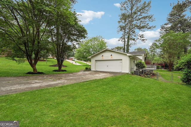 exterior space featuring concrete driveway, a garage, and fence