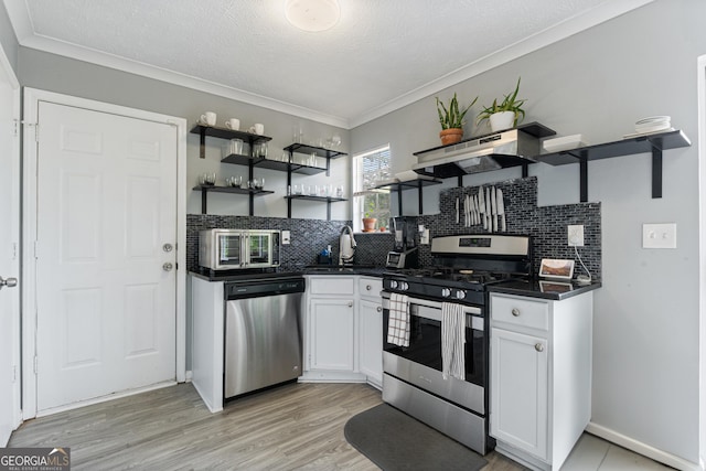 1914 Phillips Lake Blf, Lithonia, GA 30058 - kitchen featuring open shelves, white cabinetry, appliances with stainless steel finishes, and dark countertops