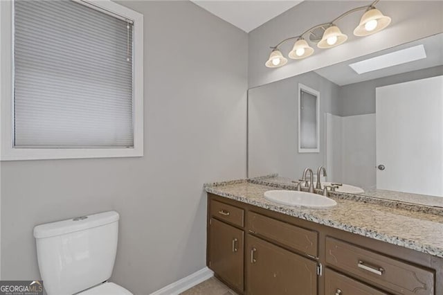 4811 Nevilly Way, Marietta, GA 30066 - bathroom featuring toilet, vanity, and baseboards