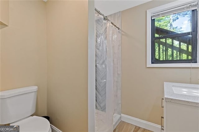4811 Nevilly Way, Marietta, GA 30066 - full bathroom with baseboards, a shower with shower curtain, toilet, and vanity