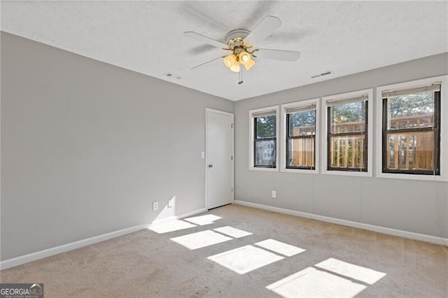 4811 Nevilly Way, Marietta, GA 30066 - unfurnished room featuring visible vents, a ceiling fan, a wealth of natural light, and carpet flooring