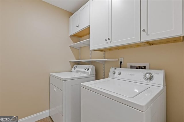 4811 Nevilly Way, Marietta, GA 30066 - clothes washing area with washing machine and clothes dryer, cabinet space, and baseboards