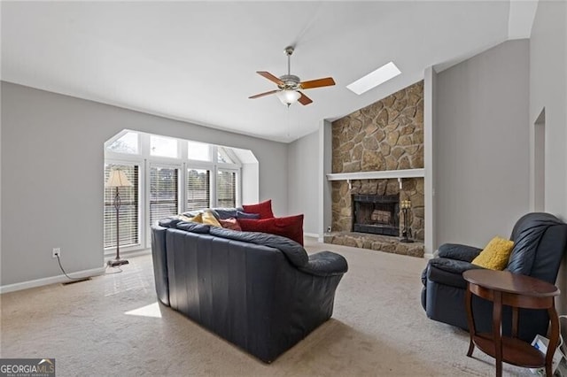 4811 Nevilly Way, Marietta, GA 30066 - living area with lofted ceiling, baseboards, carpet, a ceiling fan, and a stone fireplace