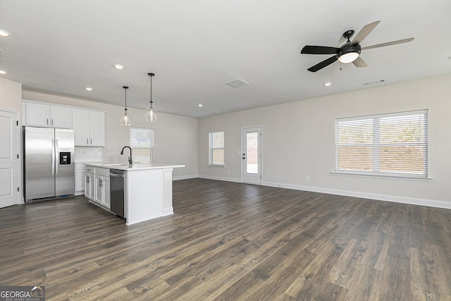 432 Cantrell Dr, Dallas, GA 30157 - kitchen featuring visible vents, stainless steel appliances, light countertops, open floor plan, and dark wood finished floors