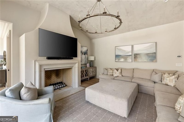 living area with vaulted ceiling and a chandelier