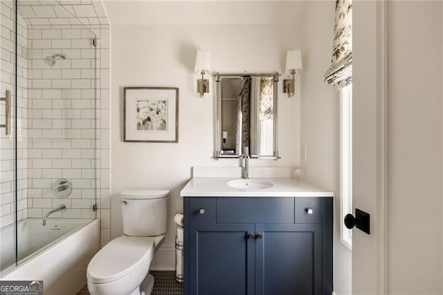 bathroom with vanity, bathtub / shower combination, and toilet