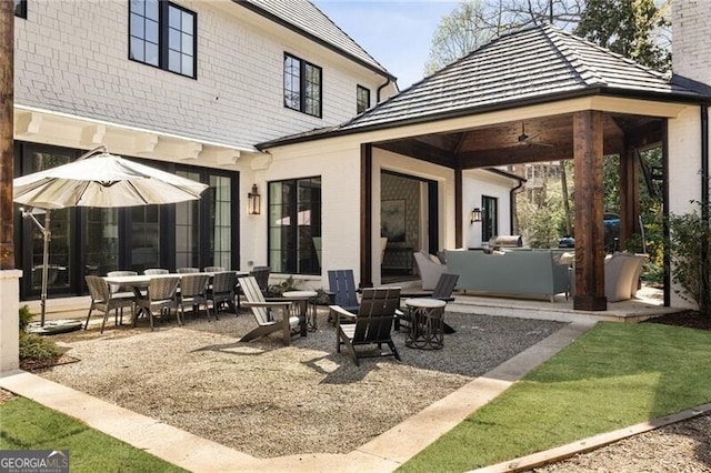 view of patio / terrace featuring a ceiling fan and a gazebo