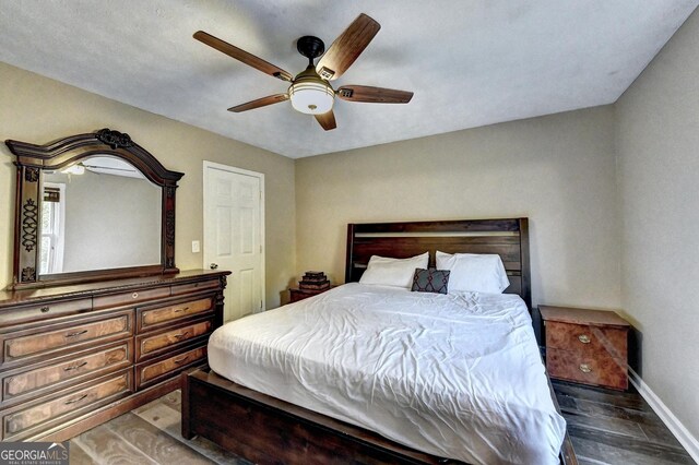4364 Saddlecreek Ct, Auburn, GA 30011 - bedroom featuring wood finished floors, ceiling fan, and baseboards