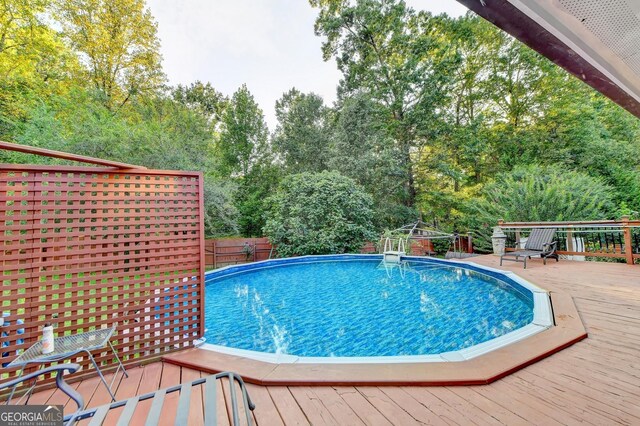 4364 Saddlecreek Ct, Auburn, GA 30011 - pool featuring a deck and fence