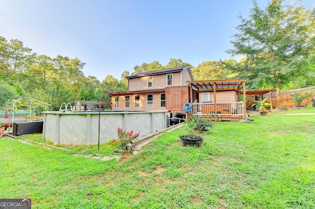 4364 Saddlecreek Ct, Auburn, GA 30011 - back of property featuring a deck, a yard, fence, central AC unit, and an outdoor pool