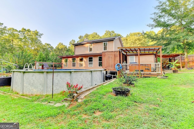 4364 Saddlecreek Ct, Auburn, GA 30011 - rear view of property featuring a deck, fence, a lawn, an outdoor pool, and a pergola