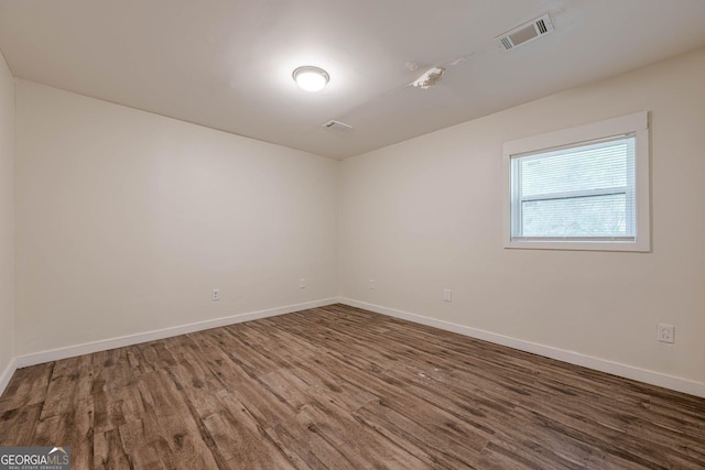 4806 Rockbridge Rd, Stone Mountain, GA 30083 - empty room with wood finished floors and baseboards