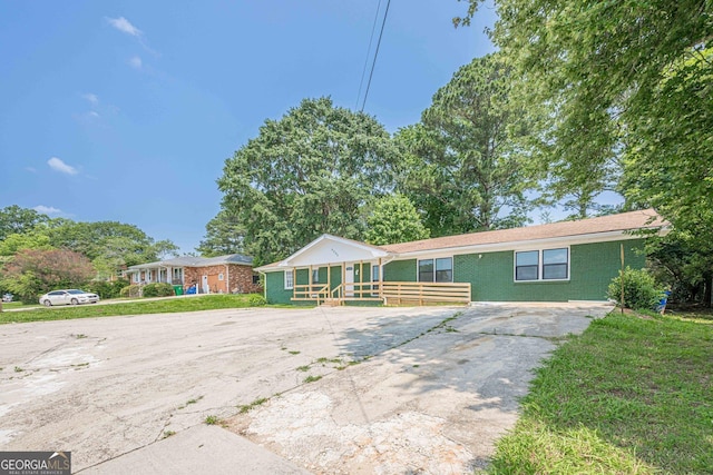 4806 Rockbridge Rd, Stone Mountain, GA 30083 - view of front facade featuring brick siding and driveway