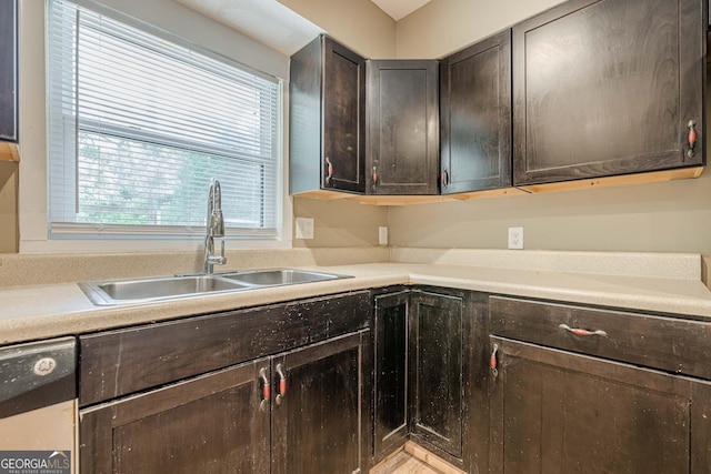 4806 Rockbridge Rd, Stone Mountain, GA 30083 - kitchen with a sink, dark brown cabinets, and light countertops