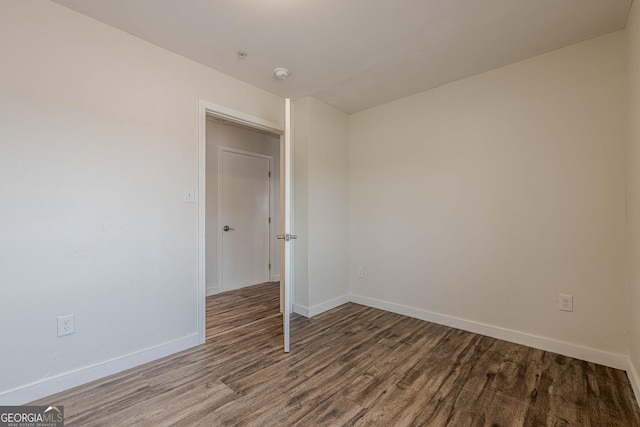 4806 Rockbridge Rd, Stone Mountain, GA 30083 - unfurnished room with wood finished floors, baseboards, and a smoke detector