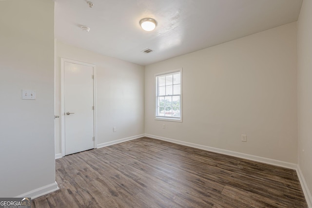 4806 Rockbridge Rd, Stone Mountain, GA 30083 - unfurnished room with wood finished floors, baseboards, and a smoke detector
