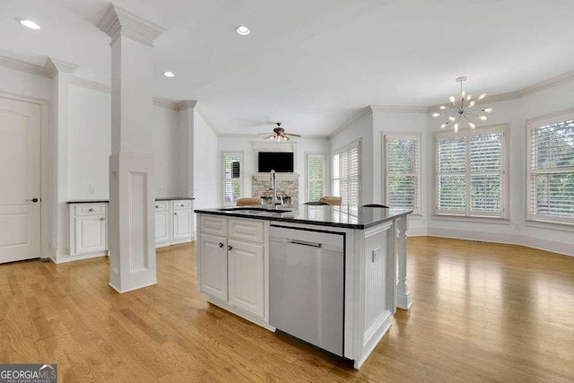 2932 Springbluff Ln, Buford, GA 30519 - kitchen with dark countertops, stainless steel dishwasher, ornamental molding, and a sink