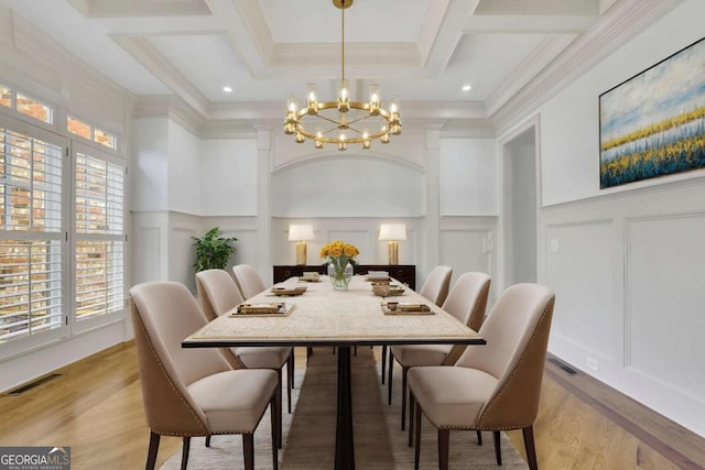 2932 Springbluff Ln, Buford, GA 30519 - dining space with light wood-type flooring, visible vents, an inviting chandelier, and a decorative wall