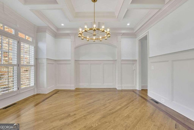 2932 Springbluff Ln, Buford, GA 30519 - unfurnished dining area featuring an inviting chandelier, a decorative wall, light wood-type flooring, and visible vents
