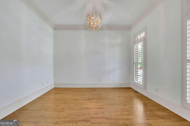 2932 Springbluff Ln, Buford, GA 30519 - unfurnished room with a raised ceiling, ceiling fan, wood finished floors, and ornamental molding
