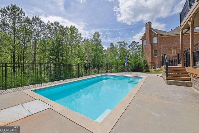 2932 Springbluff Ln, Buford, GA 30519 - view of pool with a fenced in pool and fence