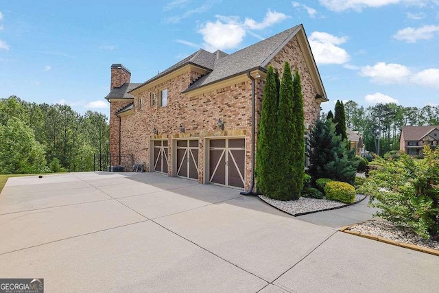2932 Springbluff Ln, Buford, GA 30519 - back of property with a chimney, fence, a fenced in pool, a wooden deck, and stairs