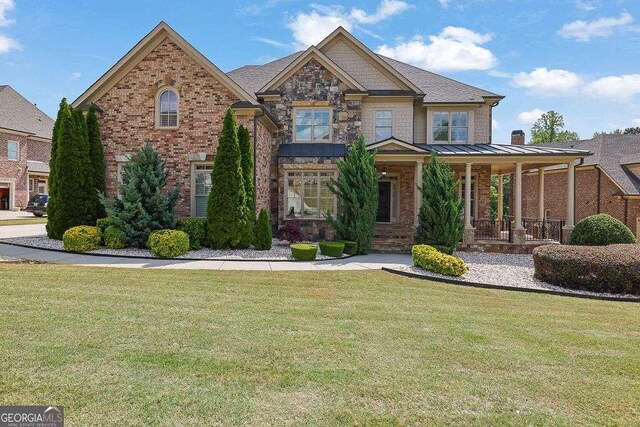 2932 Springbluff Ln, Buford, GA 30519 - view of front of property featuring a chimney, brick siding, a front lawn, and concrete driveway