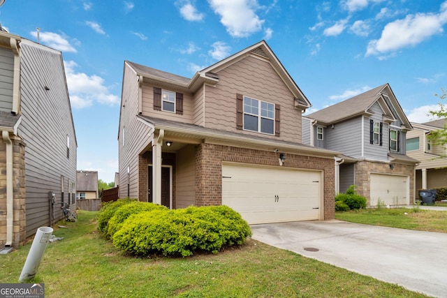 view of front of home with an attached garage, driveway, brick siding, and a front yard