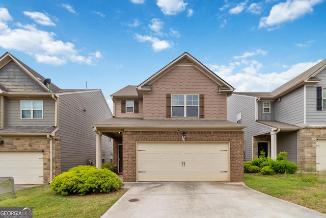 view of front facade with brick siding, an attached garage, and concrete driveway