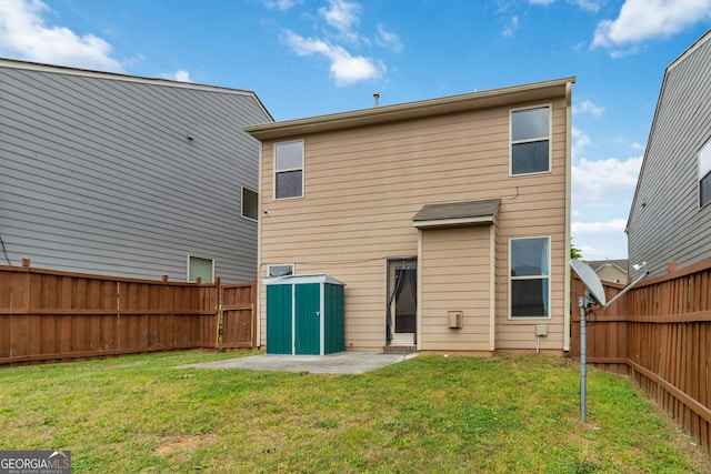 rear view of house featuring a shed and an outdoor structure