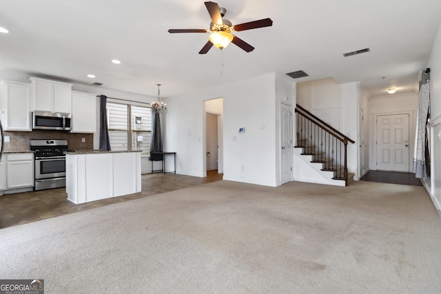 unfurnished living room featuring stairway, a ceiling fan, carpet flooring, recessed lighting, and baseboards