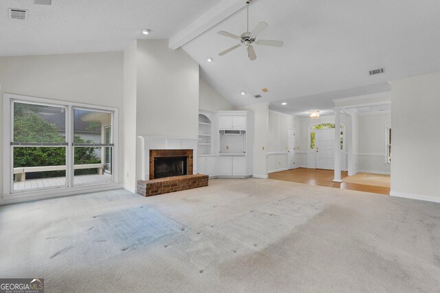 45 Herons Nest, Savannah, GA 31410 - unfurnished living room featuring visible vents, beamed ceiling, light carpet, and high vaulted ceiling