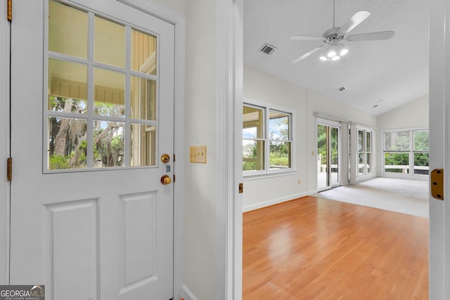 45 Herons Nest, Savannah, GA 31410 - doorway to outside with wood finished floors, ceiling fan, baseboards, visible vents, and lofted ceiling
