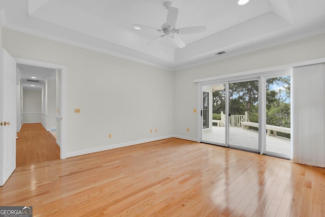 45 Herons Nest, Savannah, GA 31410 - empty room with a raised ceiling, a ceiling fan, visible vents, and light wood-style floors
