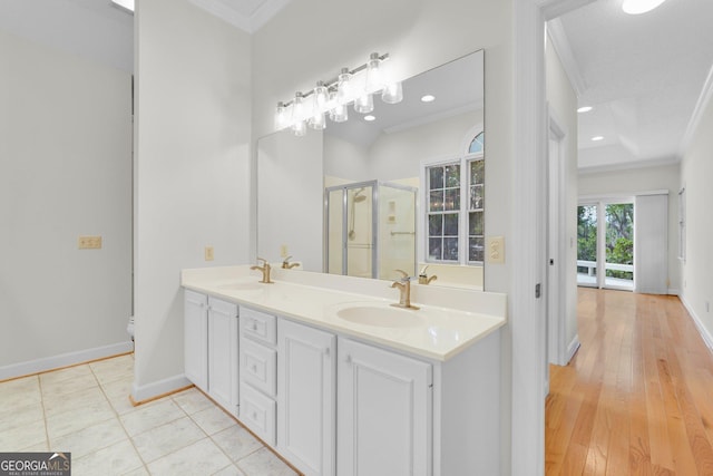 45 Herons Nest, Savannah, GA 31410 - full bathroom featuring a shower stall, a sink, double vanity, baseboards, and ornamental molding