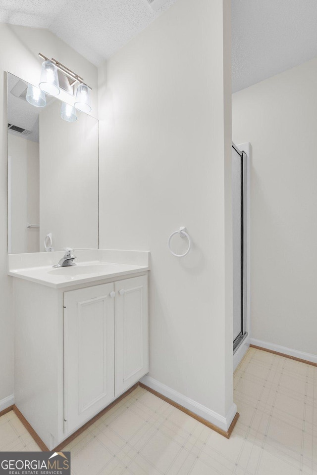 45 Herons Nest, Savannah, GA 31410 - bathroom featuring vanity, tile patterned floors, visible vents, baseboards, and a textured ceiling