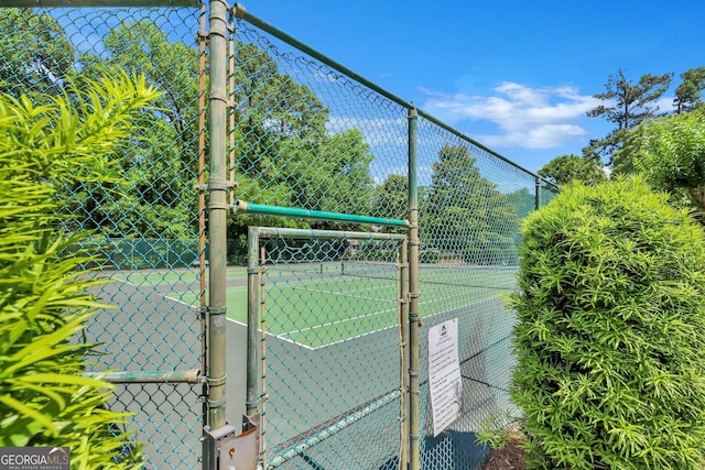 45 Herons Nest, Savannah, GA 31410 - view of tennis court featuring fence