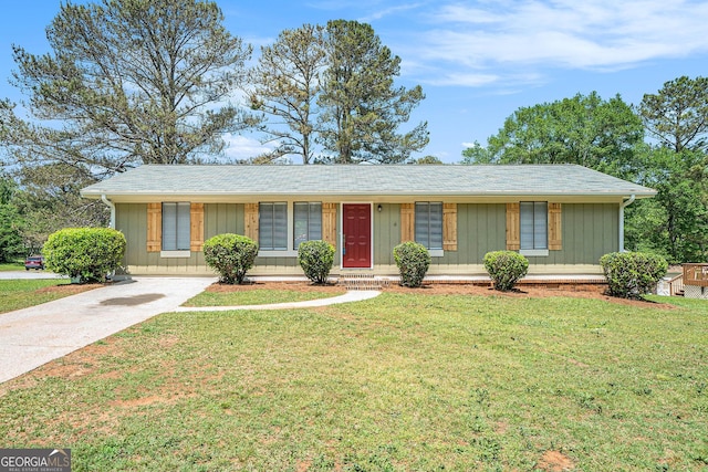 898 Doeskin Dr NW, Conyers, GA 30012 - ranch-style house with a front lawn, concrete driveway, and board and batten siding
