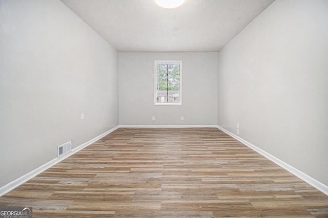 898 Doeskin Dr NW, Conyers, GA 30012 - spare room with baseboards and light wood-type flooring