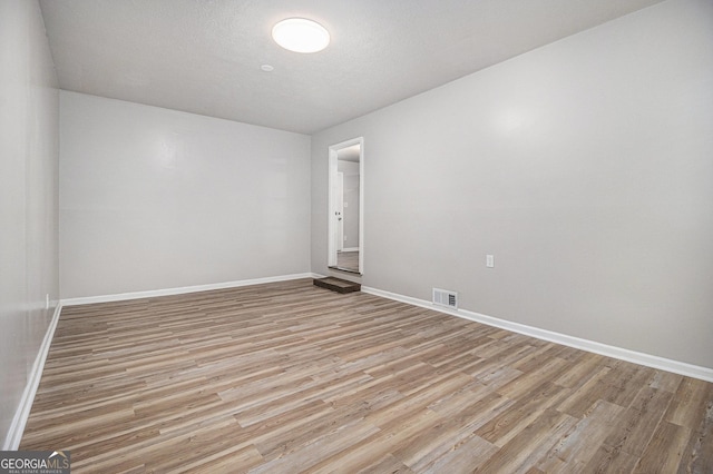 898 Doeskin Dr NW, Conyers, GA 30012 - empty room featuring light wood finished floors and baseboards