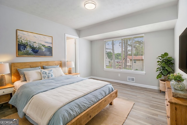 898 Doeskin Dr NW, Conyers, GA 30012 - bedroom with baseboards and light wood-style flooring