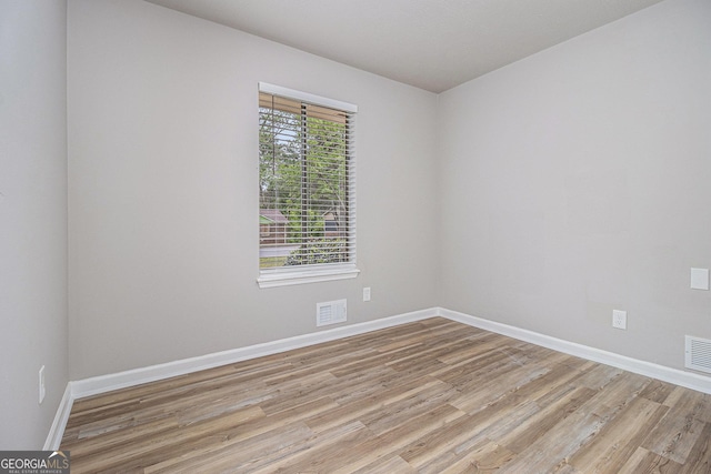 898 Doeskin Dr NW, Conyers, GA 30012 - unfurnished room with light wood-type flooring and baseboards