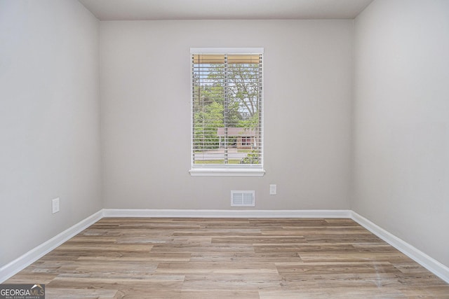 898 Doeskin Dr NW, Conyers, GA 30012 - empty room featuring light wood-style flooring and baseboards