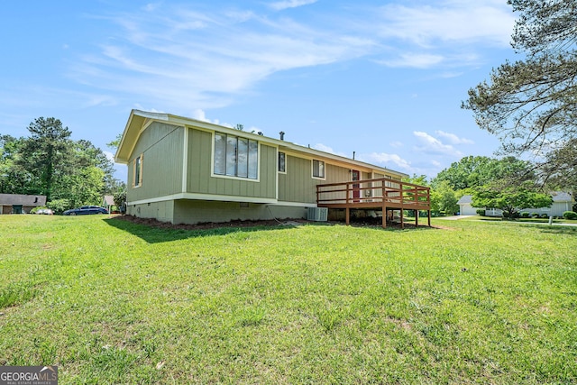 898 Doeskin Dr NW, Conyers, GA 30012 - rear view of property featuring a wooden deck, a yard, crawl space, and central AC unit