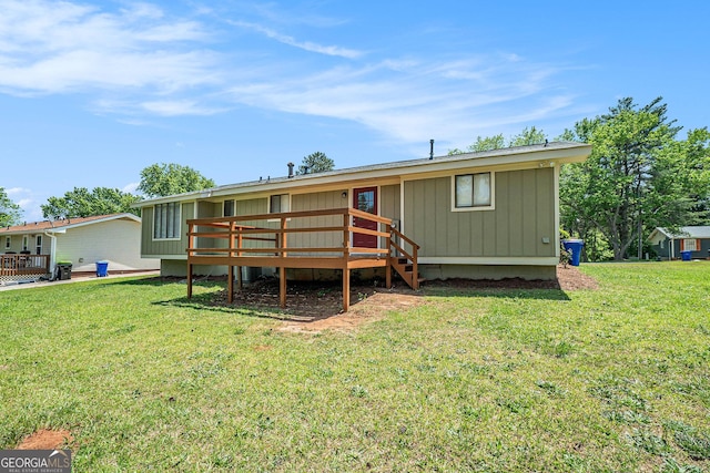 898 Doeskin Dr NW, Conyers, GA 30012 - rear view of house with a deck and a yard