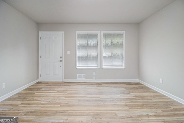 898 Doeskin Dr NW, Conyers, GA 30012 - empty room with light wood-style floors and baseboards