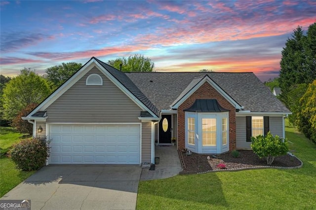 2602 Midler Ct, Buford, GA 30519 - view of front of house with concrete driveway, a garage, a front yard, and a shingled roof
